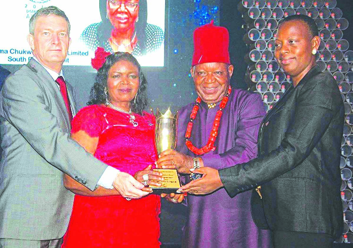 Managing DirectorNigerian Breweries Plc, Nicolaas Vervelde (left),; National Champion of the Distributors Award 2015, Dem Joy Igwe and Sir Gabriel Igwe of Ifeoma Chukwuka Nigeria Limited; and the Nigerian Breweries Managing Director’s wife, Clementine Vervelde at the Distributors’ Award in Lagos...recently.