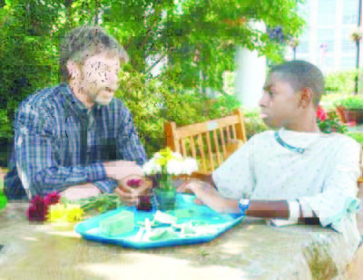 5. Plants help chldren , a horticultural therapy patient makes a fower arrangement Copy
