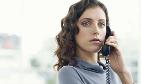 Young woman talks on phone