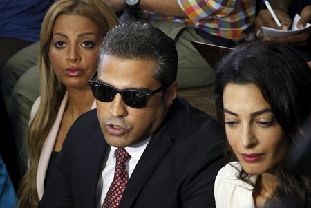 Fahmy talks to the media before hearing the verdict at a court in Cairo