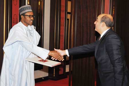 President Buhari recieivng the letter of credence from the new Turkish ambassador to Nigeria, Hakan Cakil at the State House, Abuja, today.