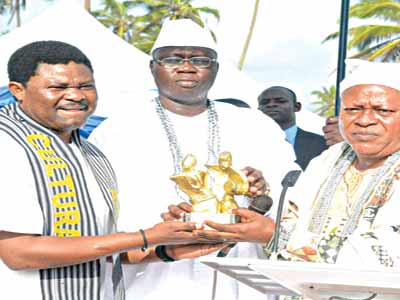 Actor Yomi Fash (left), Otunba Gani Adams and a guest at the event.