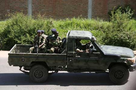 Burundi military personnel drive through the Musaga neighbourhood of Bujumbura on December 11, 2015 (AFP Photo)