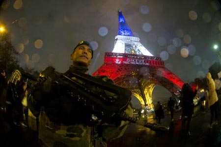 A French soldier on guard at the Eiffel Tower in Paris, following a terror attack that left 130 people dead in the capital city on November 13, 2015 PHOTO: AFP