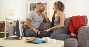 african-american-couple-talking-together-couch-home-47557946