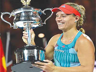 Angelique Kerber lifts the Australian Open trophy PHOTO: SPORTINGLIFE.COM
