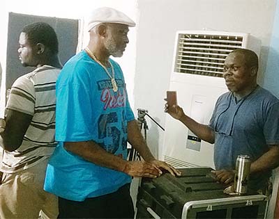 Producer, Mr. Williams and star actor, Mr. Richard Mofe-Damijo during a chitchat on set of Three Wise Men at Ikorodu last week