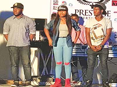 Second runner up Prestige Open mic contest, King Juan (left), Winner, Ifeatu and first runner up, Roey after being declared winners of the competition. 