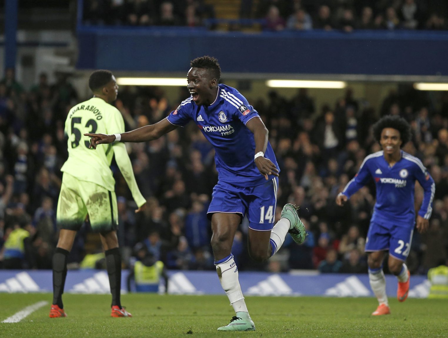Chelsea's Burkina Faso midfielder Bertrand Traore (C) celebrates scoring their fifth goal during the English FA Cup fifth round football match between Chelsea and Manchester City at Stamford Bridge in London on February 21, 2016. Chelsea won the game 5-1. / AFP / ADRIAN DENNIS / RESTRICTED TO EDITORIAL USE. No use with unauthorized audio, video, data, fixture lists, club/league logos or 'live' services. Online in-match use limited to 75 images, no video emulation. No use in betting, games or single club/league/player publications. /