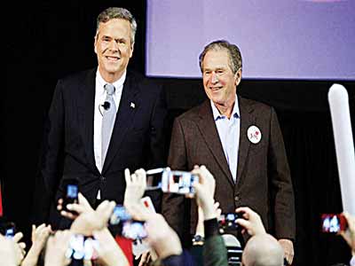 Jeb Bush (left) is joined by his brother, former President George W. Bush, on the campaign trail for the first time on Monday at a rally in North Charleston, S.C. PHOTO: RANDALL HILL/REUTERS