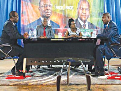 Presidential candidates: Faustin-Archange Touadera (right) and Anicet-Georges Dologuele (left) face each other during a live television debate ahead of yesterday’s second round election, in Bangui, Central African Republic. PHOTO: REUTERS/SIEGFRIED MODOLA