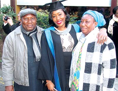 Miss Emmanuella Onyinye Ejime, flanked by her parents during the 2016 Kingston University, United Kingdom graduation, where she earned a commendation upon obtaining an LLM International Commercial Law