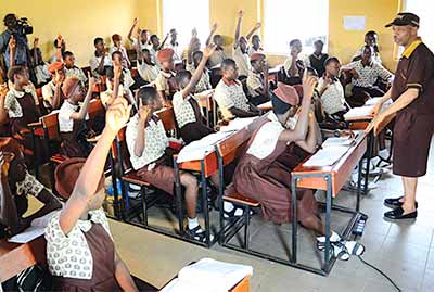 Nollywood comic actor, Hafiz Oyetoro, also known as Saka (right) answering questions from students of Salvation Army Middle School, during his visit to the school at Alekuwodo, Osogbo, State of Osun 