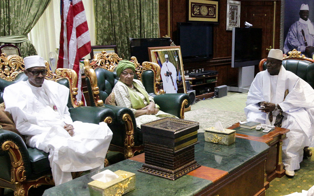 A handout picture released by the Nigerian Presidency on January 13, 2017 shows Nigerian President Muhammadu Buhari (L) and Liberian President Ellen Johnson Sirleaf meeting Gambian President Yahya Jammeh (R) in Banjul. West African leaders began crisis talks with President Yahya Jammeh on January 13 over his refusal to leave power, as fears grew of a refugee exodus caused by the nation's political impasse. Nigerian President Muhammadu Buhari is leading the three-nation delegation that includes Ghana's former president John Mahama and Liberian leader Ellen Johnson Sirleaf, who attempted similar negotiations last month without success. / AFP PHOTO / NIGERIAN PRESIDENCY / Handout / 