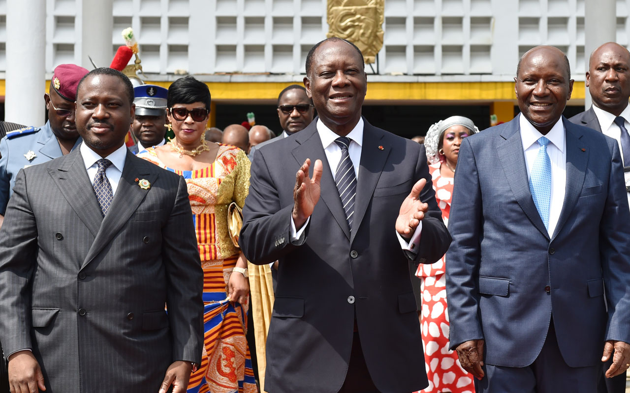 Ivorian President Alassane Ouattara (C), flanked by newly re-elected Ivorian National Assembly president Guillaume Soro (L) and former Ivorian prime minister and newly appointed Ivory Coast's Vice-President Daniel Kablan Duncan, walks out the National Assembly in Abidjan on January 10, 2017. Former Ivorian prime minister Kablan Duncan, who resigned along with his government on January 9, has been appointed Ivory Coast's Vice-President on January 10, 2017. Ivory Coast initiated a post-election reshuffle on January 9 and fired the heads of its armed forces and police after a brief army mutiny that stoked security fears in the world's top cocoa producer. / AFP PHOTO / ISSOUF SANOGO
