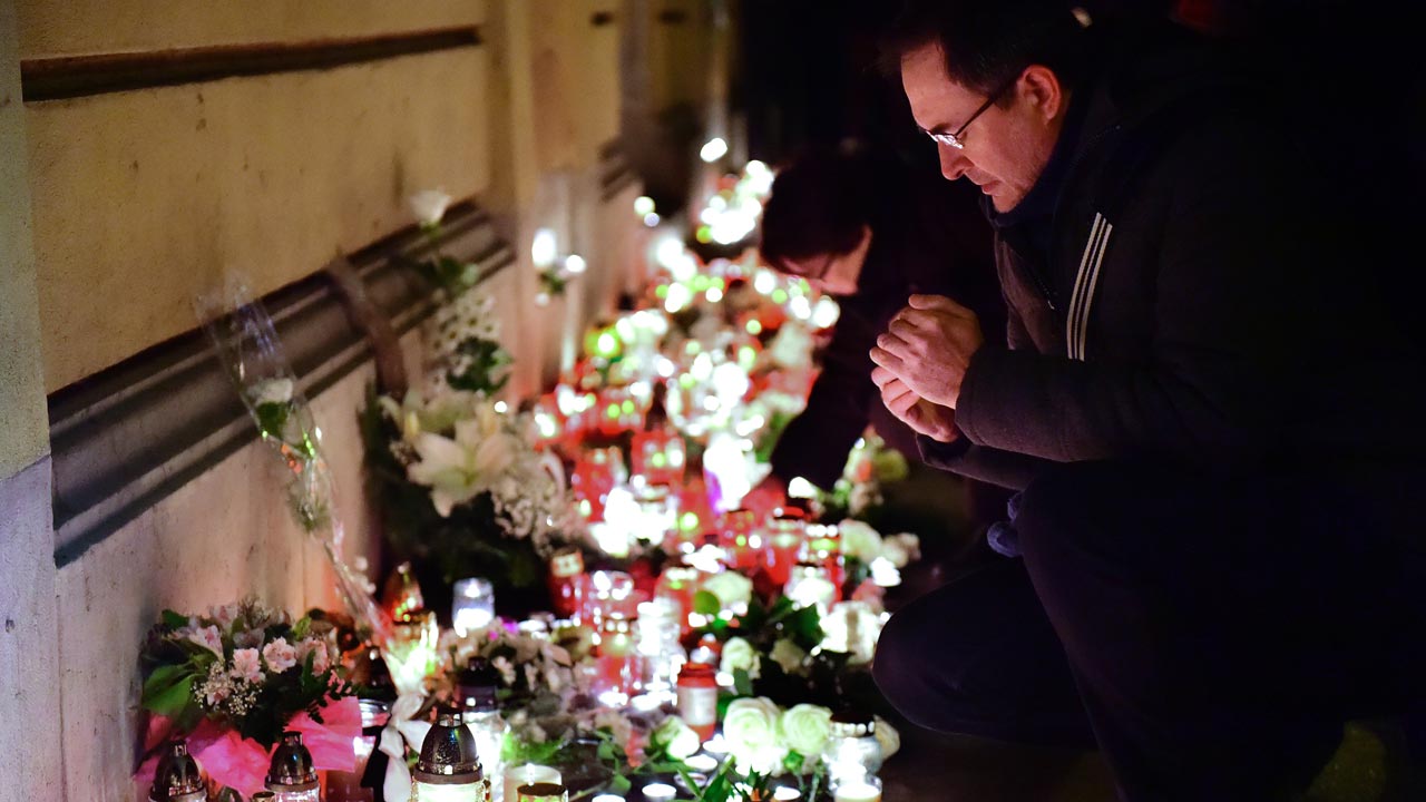 Candles and flowers are placed at the Szinyei Merse Pal High-school in Budapest on January 21, 2017, to commemorate the victims of a bus accident in Italy. At least 16 people died when a coach bringing Hungarian teenagers home from a skiing trip crashed and burst into flames on a northern Italian motorway overnight, authorities said on January 21. Emergency workers said that the bus carrying 56 people returning from France, most of them teenagers aged 14-16, as well as several teachers and two drivers, ploughed into a bridge pillar. ATTILA KISBENEDEK / AFP