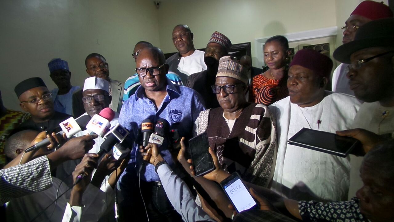 Governor Ayo Fayose of Ekiti State (C) talking to newsmen after his election as the chairman of PDP governors' forum.