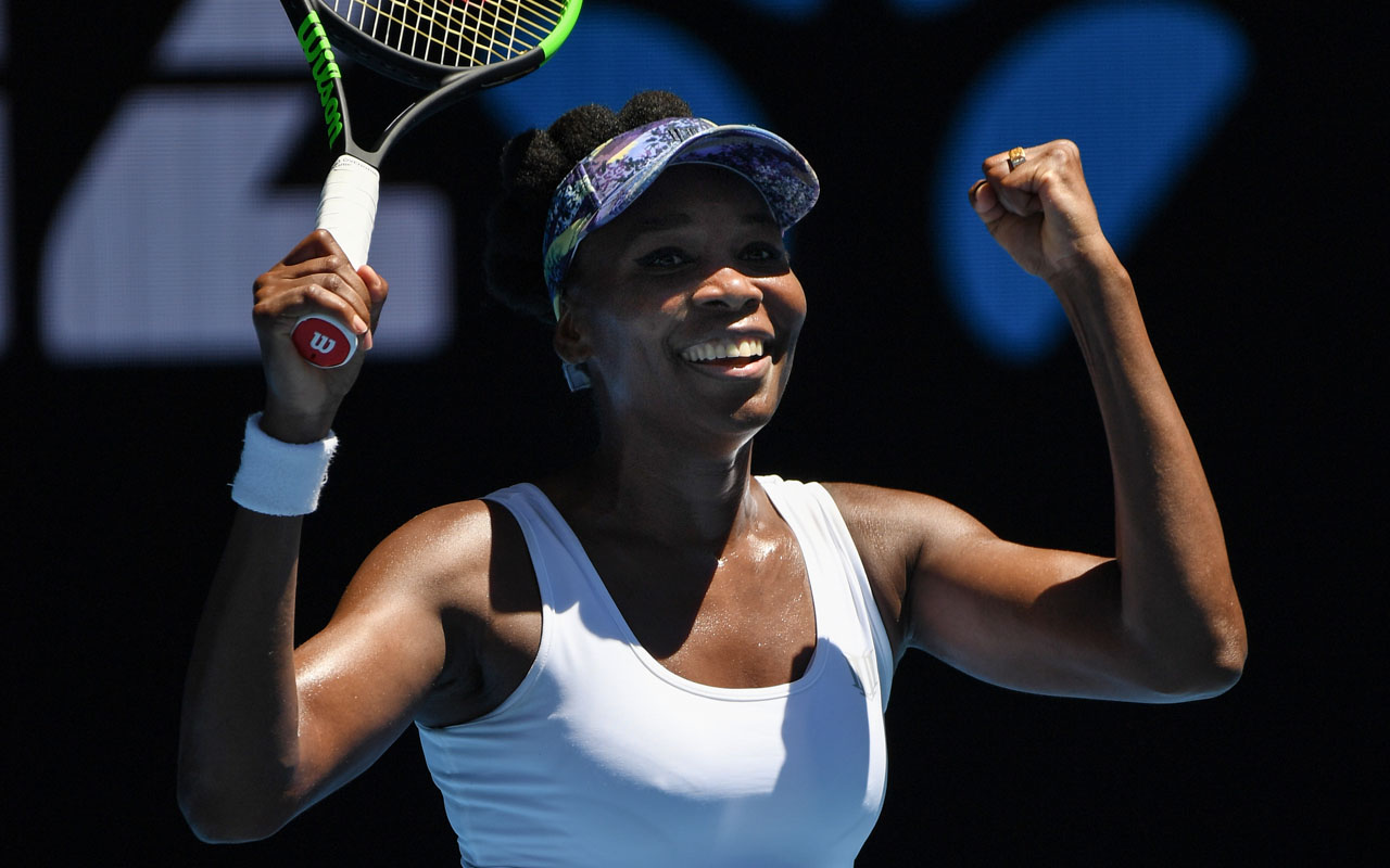 Venus Williams of the US celebrates her victory against Germany's Mona Barthel during their women's singles fourth round match on day seven of the Australian Open tennis tournament in Melbourne on January 22, 2017. / AFP PHOTO / GREG WOOD /