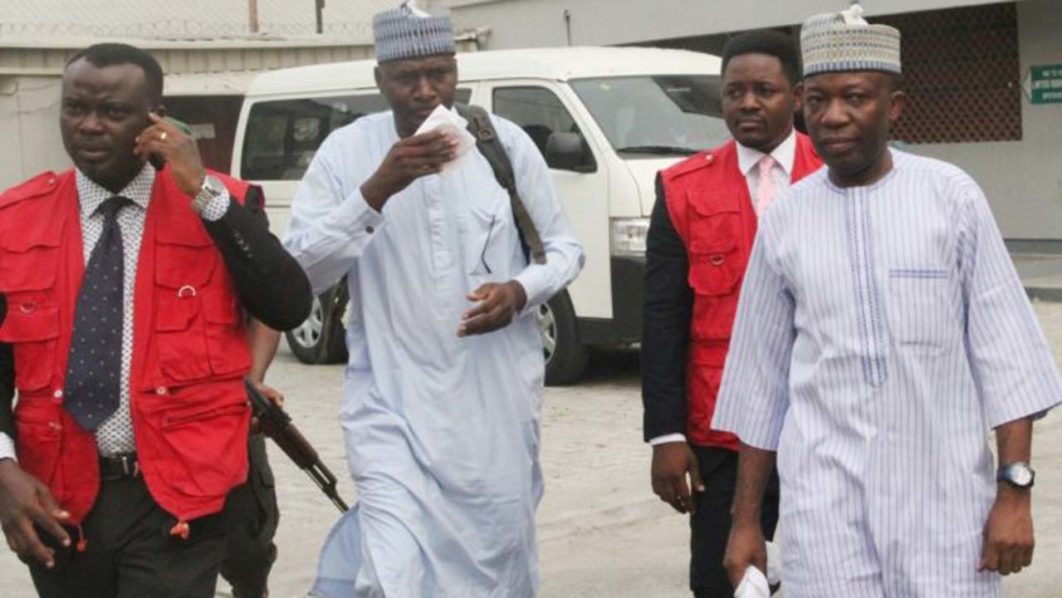 MUHAMMED-DELE-BELGORE-AND-PROF.-ABUBAKAR-SULAIMAN-ON-THEIR-WAY-TO-THE-COURTROOM.-e1486570812286