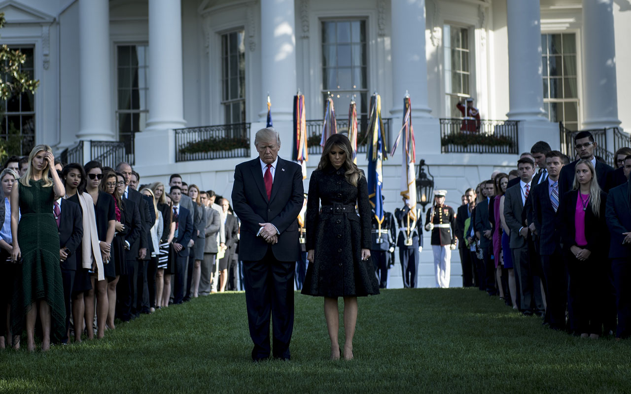 US President Donald Trump and First Lady Melania Trump observe a moment of silence at the White House on the anniversary of 9/11