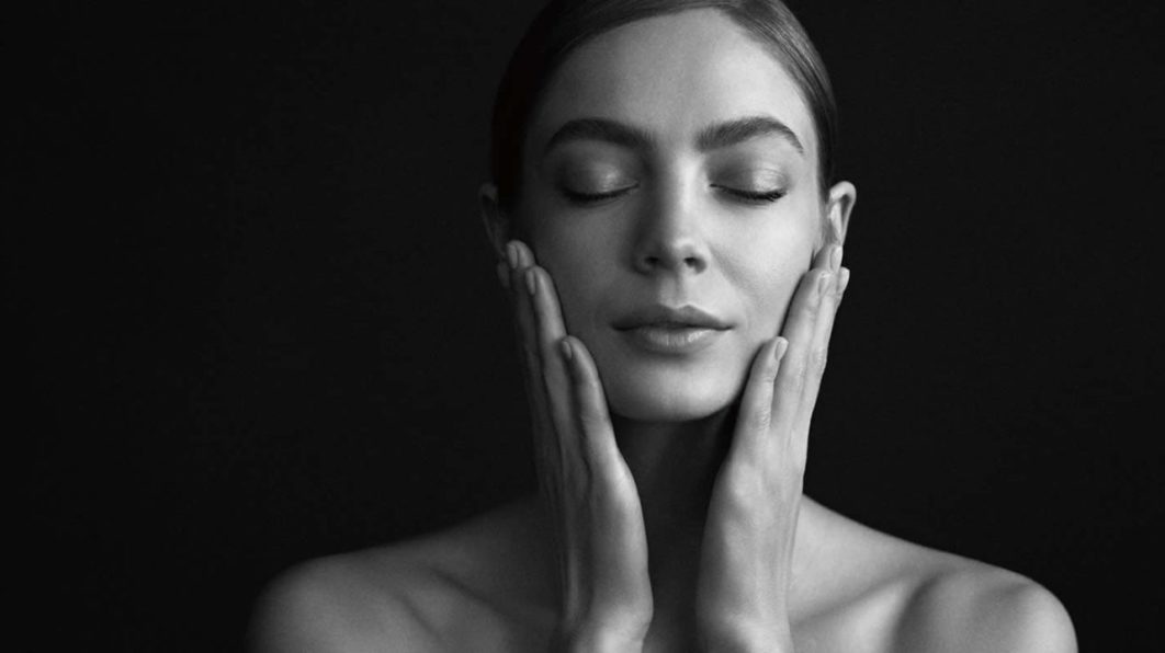 woman touching face