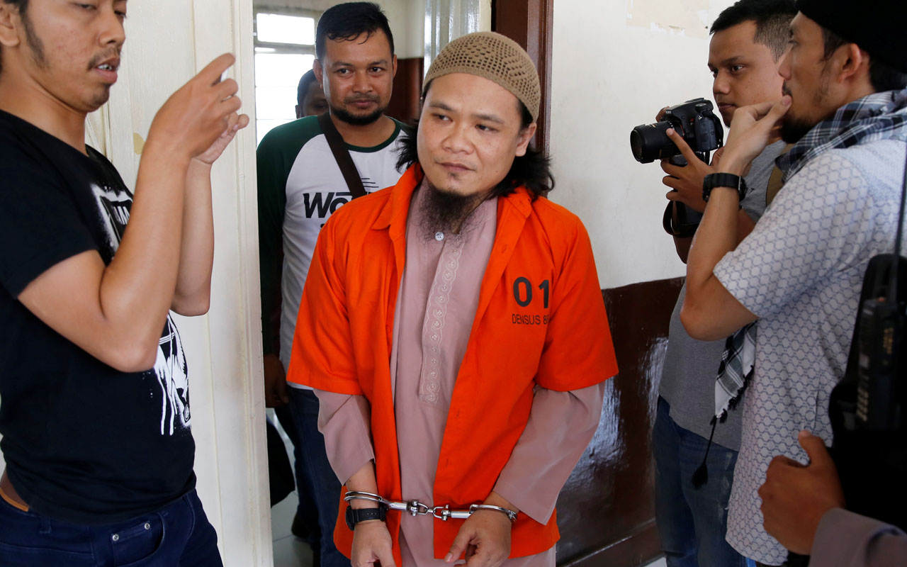 Kiki Muhamad Iqbal, convicted of masterminding suicide bombings at Jakarta’s bus terminal in 2017, leaves the courtroom after his trial in Jakarta
