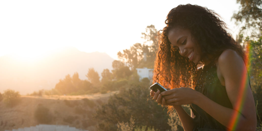 Woman using a phone. Photo Christopher Malcolm via Getty Images