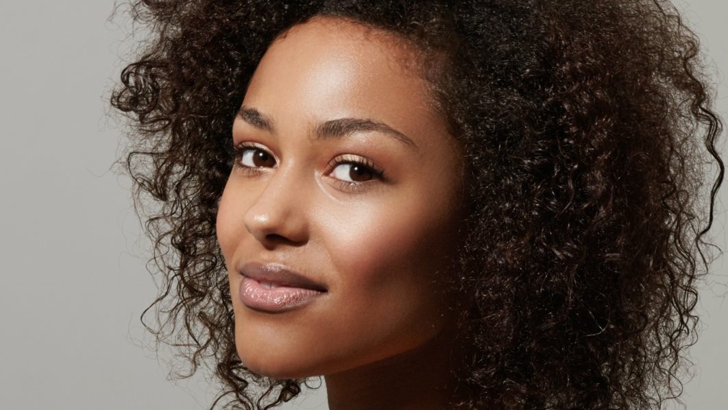 Head shot of a naturally beautiful woman looking at the camera