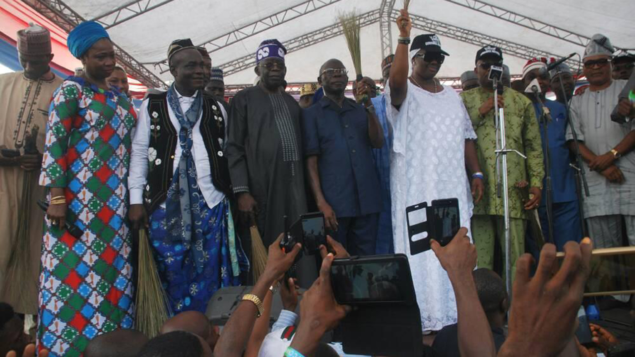 APC-leaders-at-the-Ikot-Ekpene-rally-with-Ekaette-Akpabio-holding-the-broom-with-hubby-Senator-Godswill-Akpabio