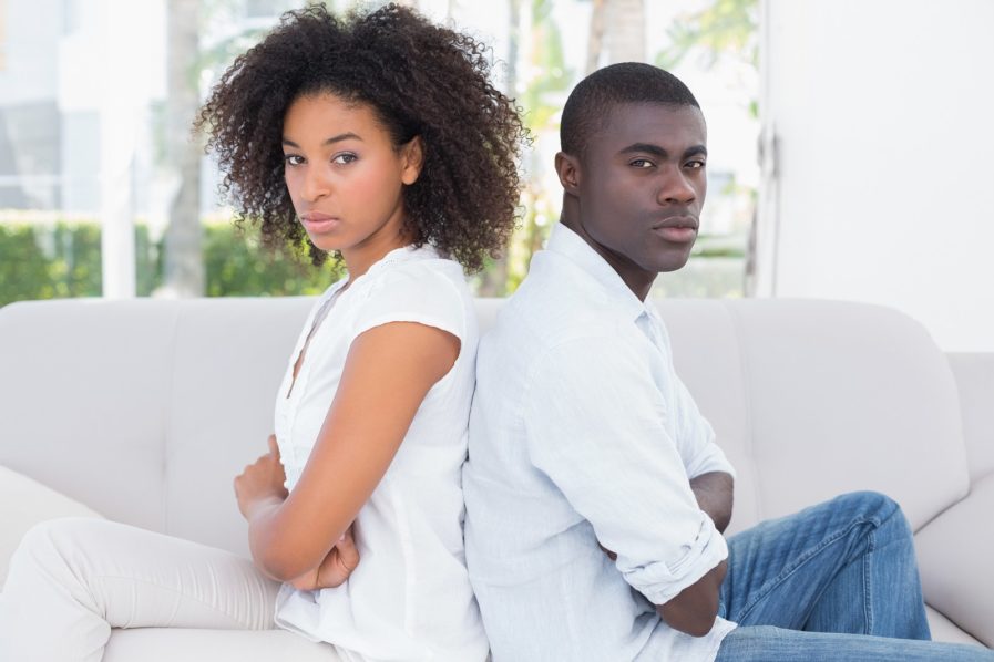 Attractive couple not talking on the couch at home in the living