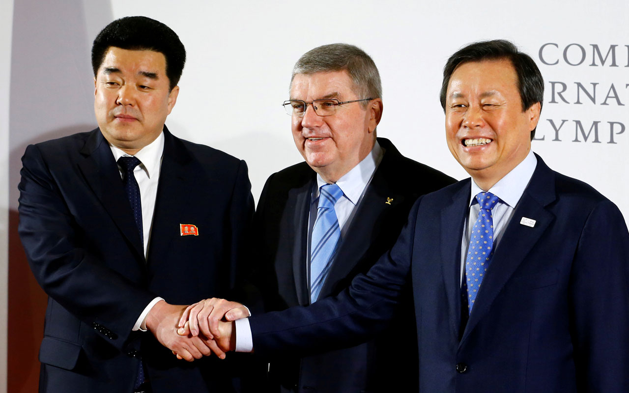 IOC President Thomas Bach welcomes the delegations of North and South Korea at the IOC headquarters in Lausanne