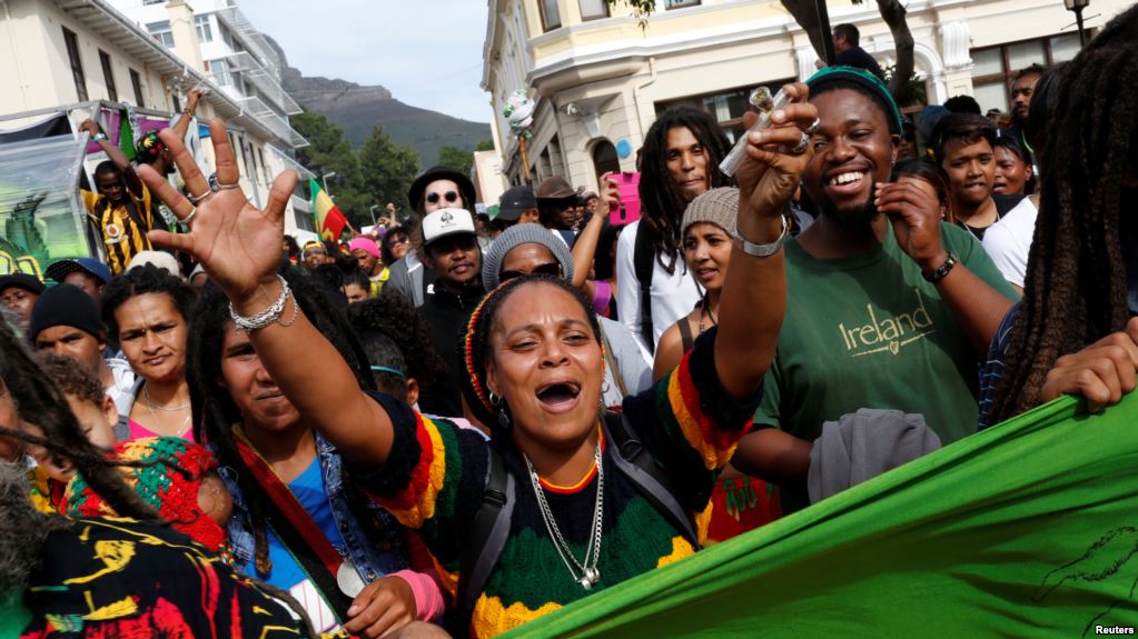 Protester carring weed pipe photo VOA News
