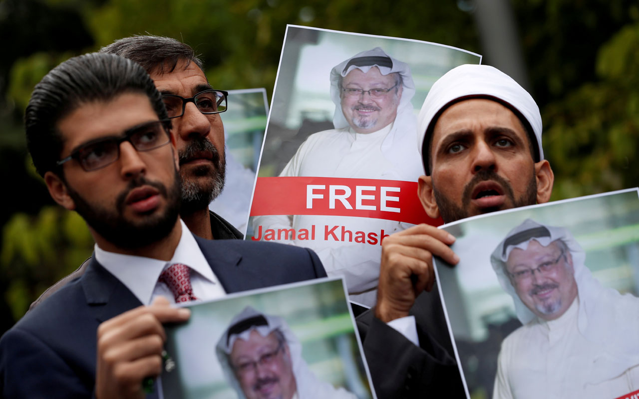 FILE PHOTO: Human rights activists and friends of Saudi journalist Khashoggi hold his pictures during a protest outside the Saudi Consulate in Istanbul