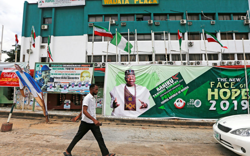 A man walks past the People’s Democratic Party headquarters in Abuja