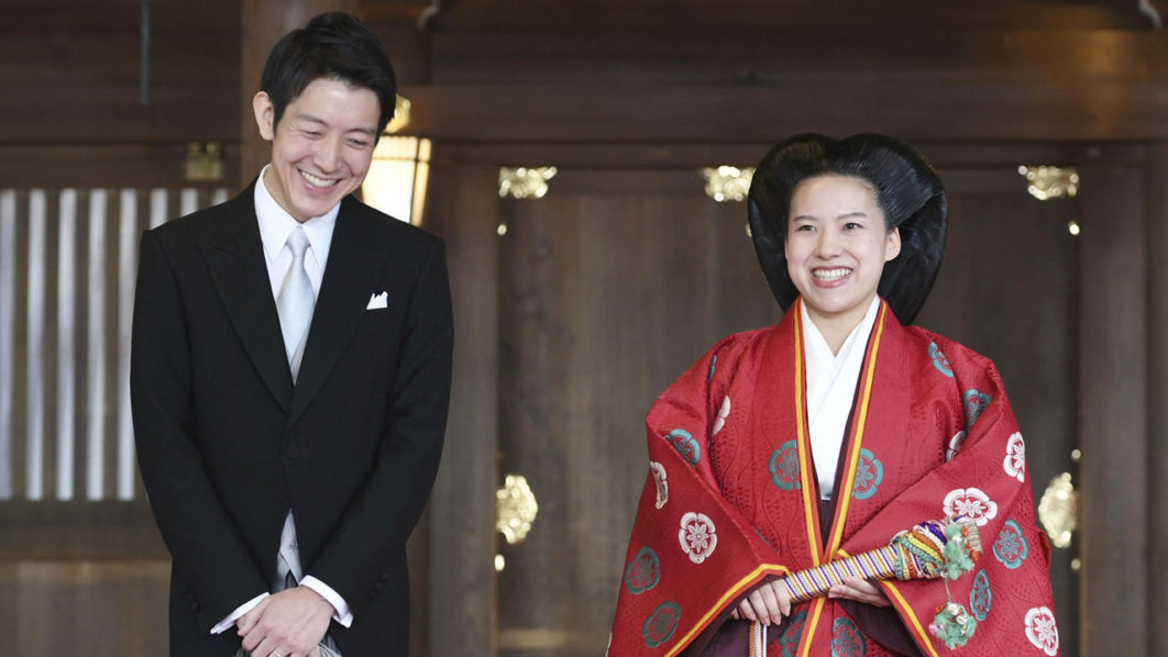 Japanese Princess Ayako and her husband Kei Moriya answer reporters’ questions after their wedding ceremony at the Meiji Shrine in Tokyo
