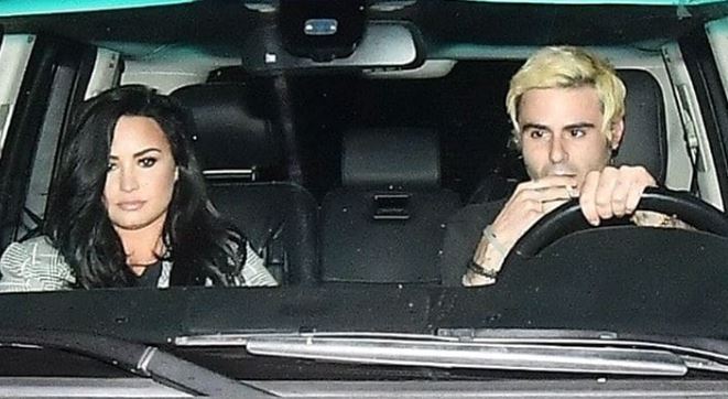 Demi Lovato and a guy