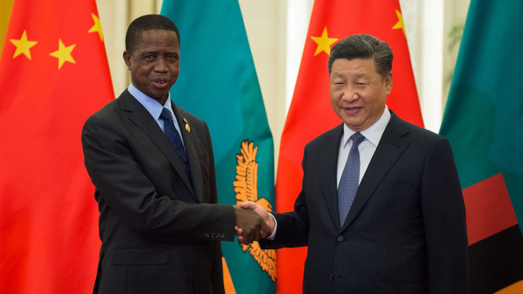 Zambia’s President Edgar Lungu shakes hands with China’s President Xi Jinping before their bilateral meeting at the Great Hall of the People in Beijing