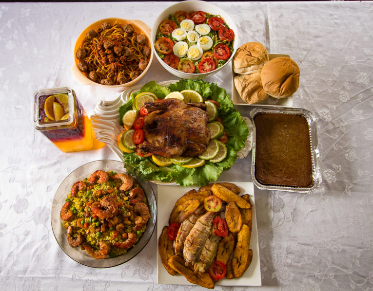 Pasta,prawn fried ric,roast chicken,banana bread, bread buns,garlic lemon fish and plantain, egg salad and fruit punch Photo Kaplin photo