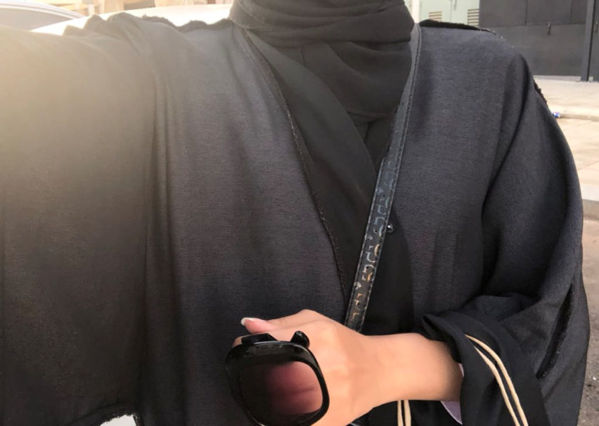 A woman is seen wearing an abaya inside out in Saudi Arabia