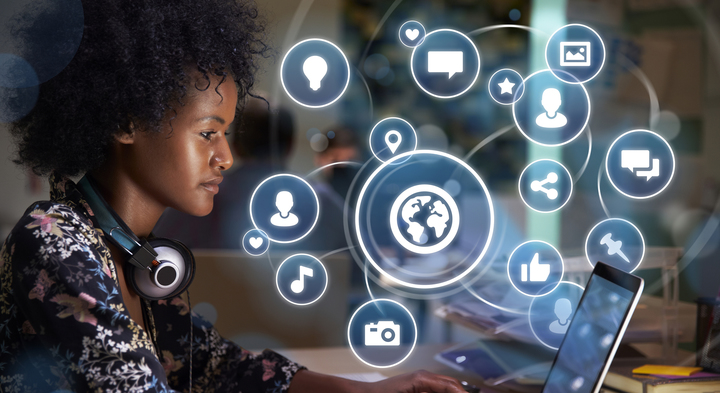 Young woman on social media with holographic icons