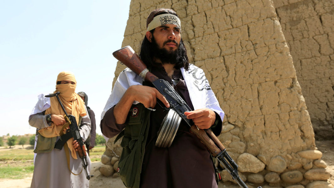 FILE PHOTO: Taliban walk as they celebrate ceasefire in Ghanikhel district of Nangarhar province, Afghanistan