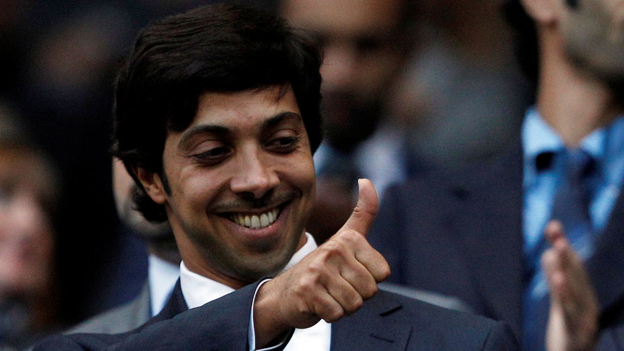 FILE PHOTO: Manchester City’s owner Sheikh Mansour bin Zayed Al Nahyan gestures before their English Premier League soccer match against Liverpool at the City of Manchester stadium in Manchester