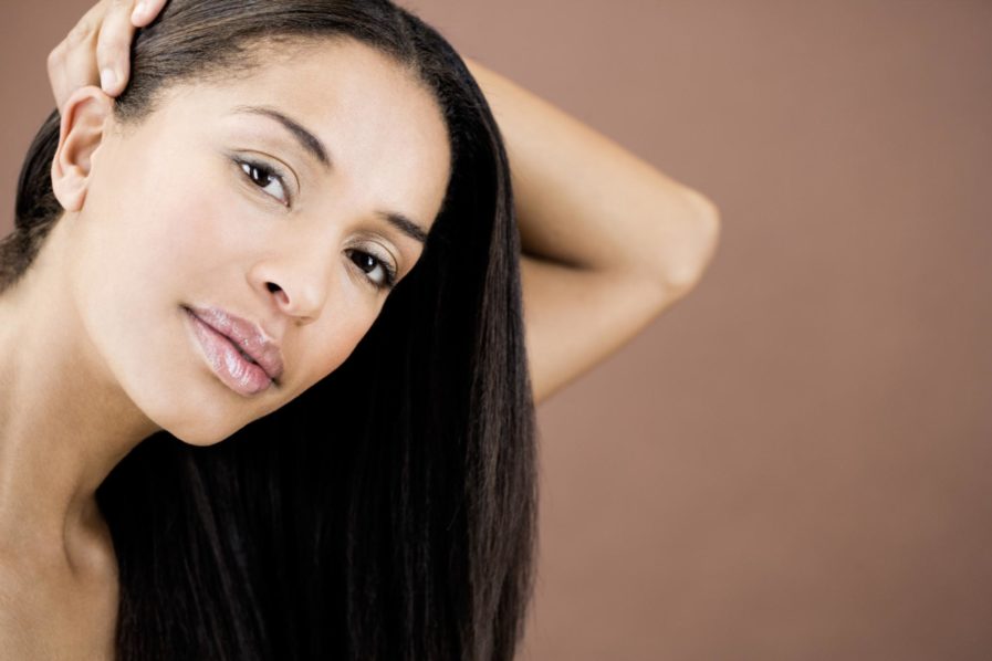A woman with healthy black hair Photo – Essence