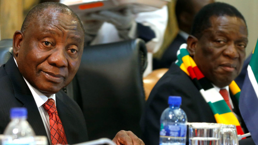 Zimbabwe’s President Emmerson Mnangagwa and his South African counterpart Cyril Ramaphosa arrive for bilateral talks in Harare