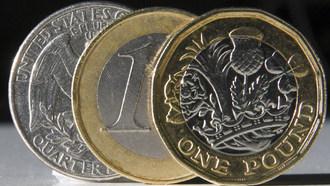 FILES-BRITAIN-EU-POLITICS-BREXIT-FOREX-POUND-EURO-DOLLAR