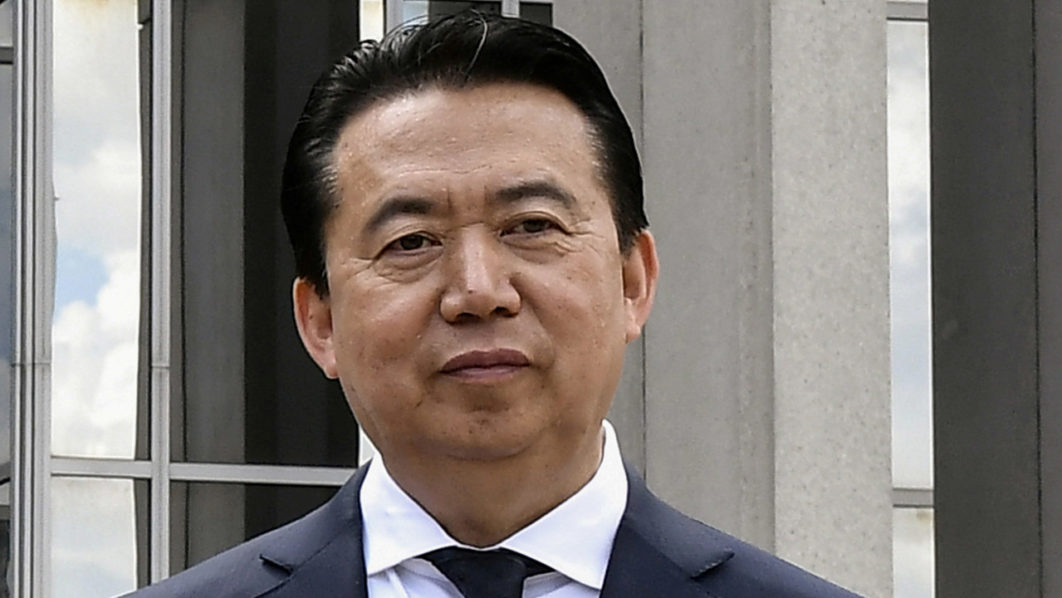 FILE PHOTO: INTERPOL President Meng Hongwei poses during a visit to the headquarters of International Police Organisation in Lyon
