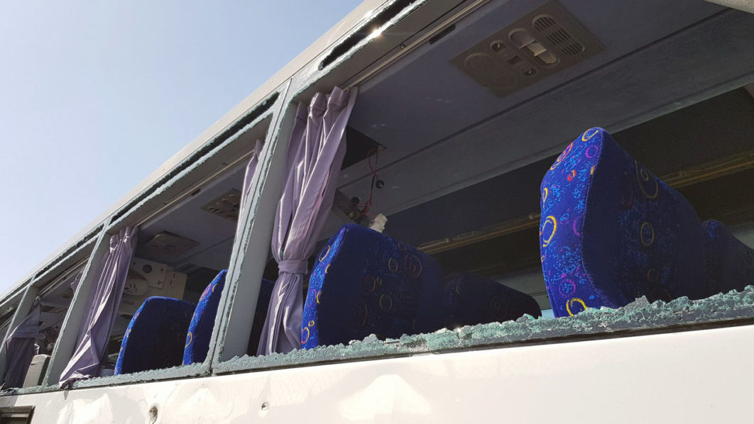 A damaged bus is seen at the site of a blast near a new museum being built close to the Giza pyramids in Cairo