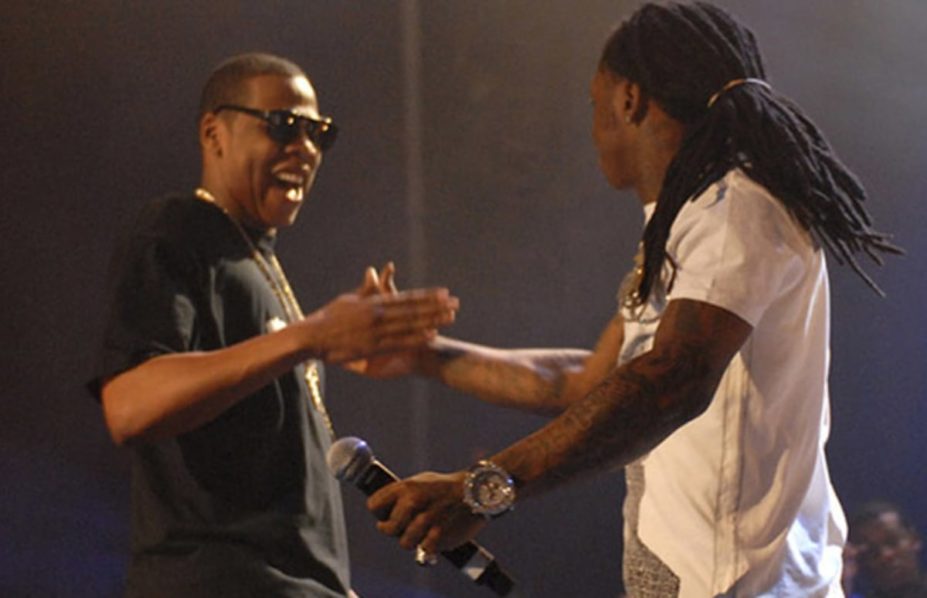 Jay Z and Lil Wayne exchanging pleasantries on stage, Photo. Complex