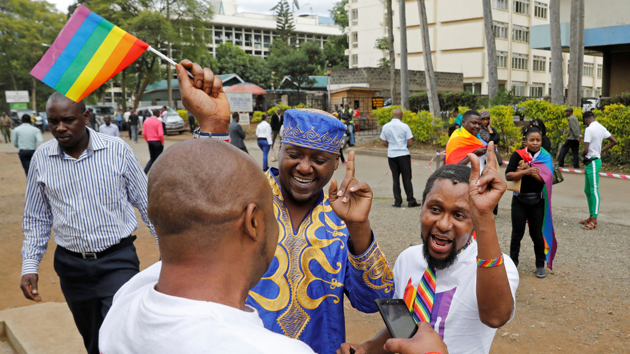 LGBT activists gather for the ruling on whether to uphold or nullify law banning gay sex, outside the Milimani high Court in Nairobi