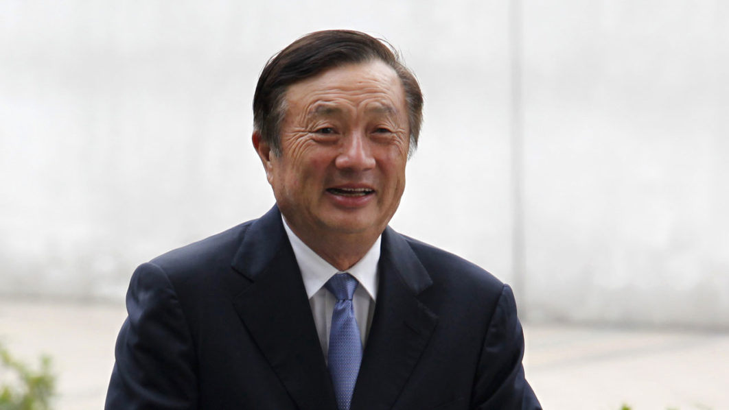 Huawei CEO and founder Ren Zhengfei walks inside Huawei’s headquarters in Shenzhen